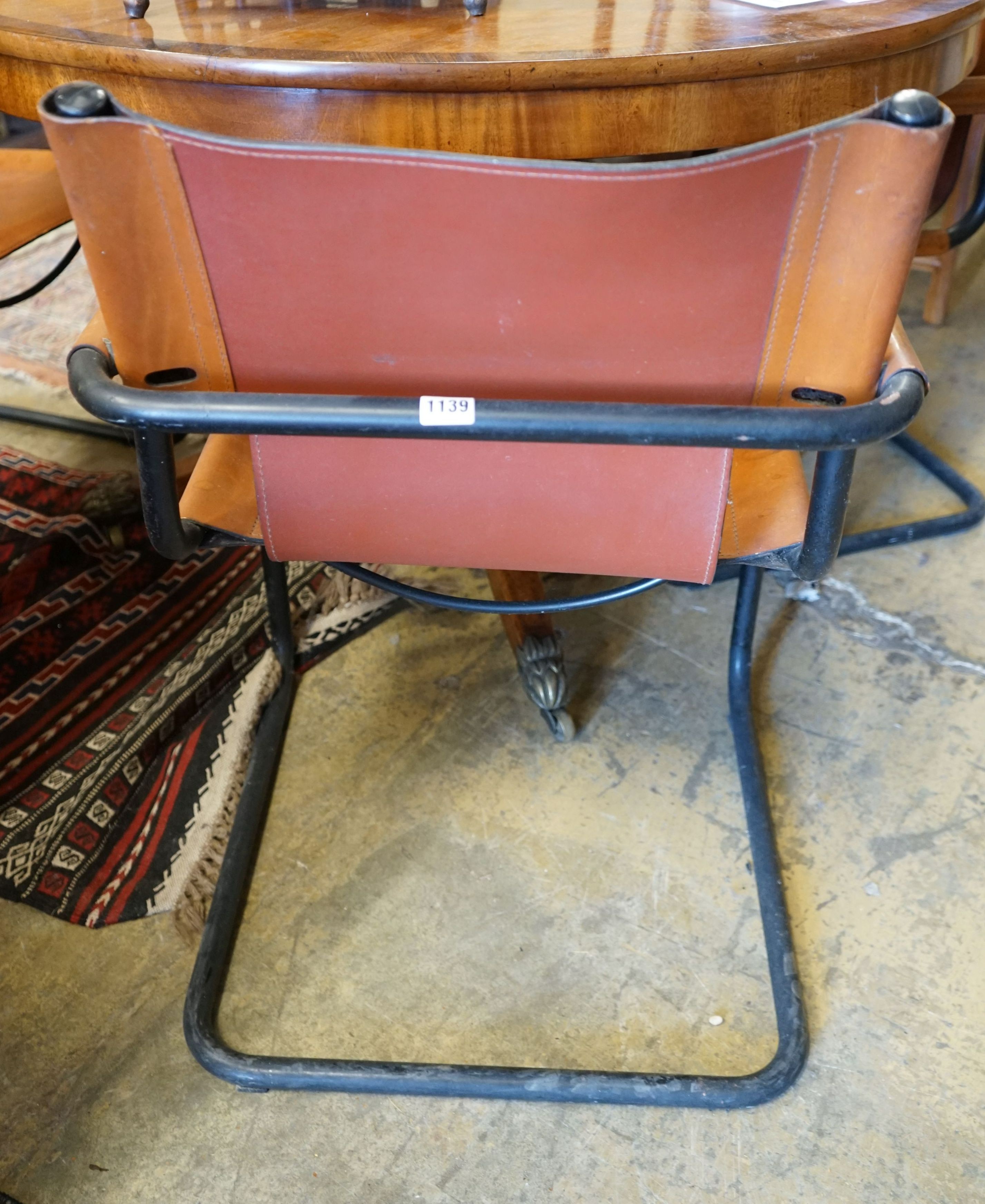 A set of four contemporary tan leather cantilver dining chairs, width 56cm depth 50cm height 79cm